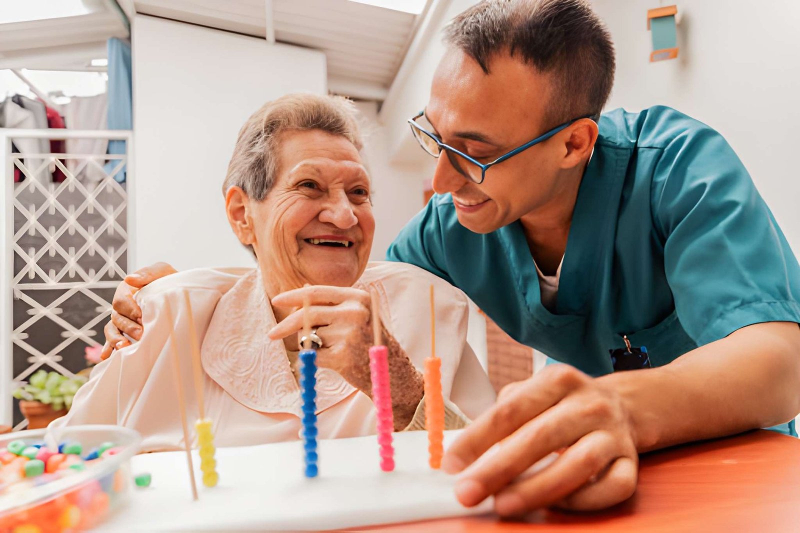 Caregiver holding patient's hand